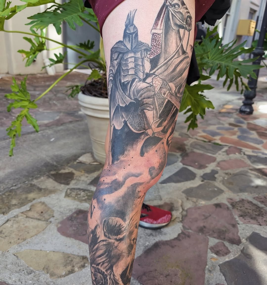 Bold black and gray armored sleeve with organic textures on calf