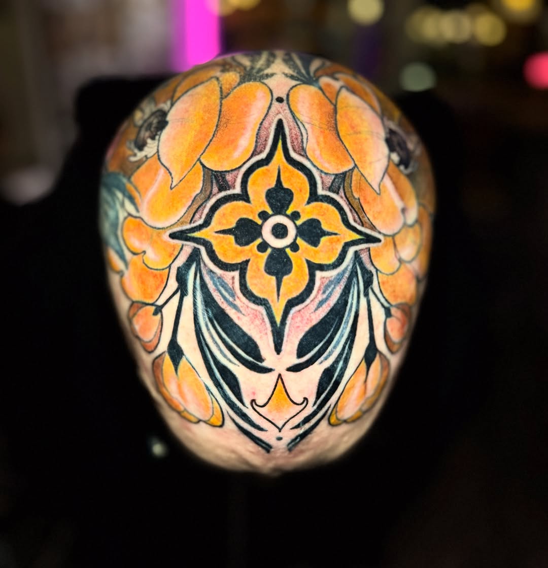 Colorful floral head tattoo