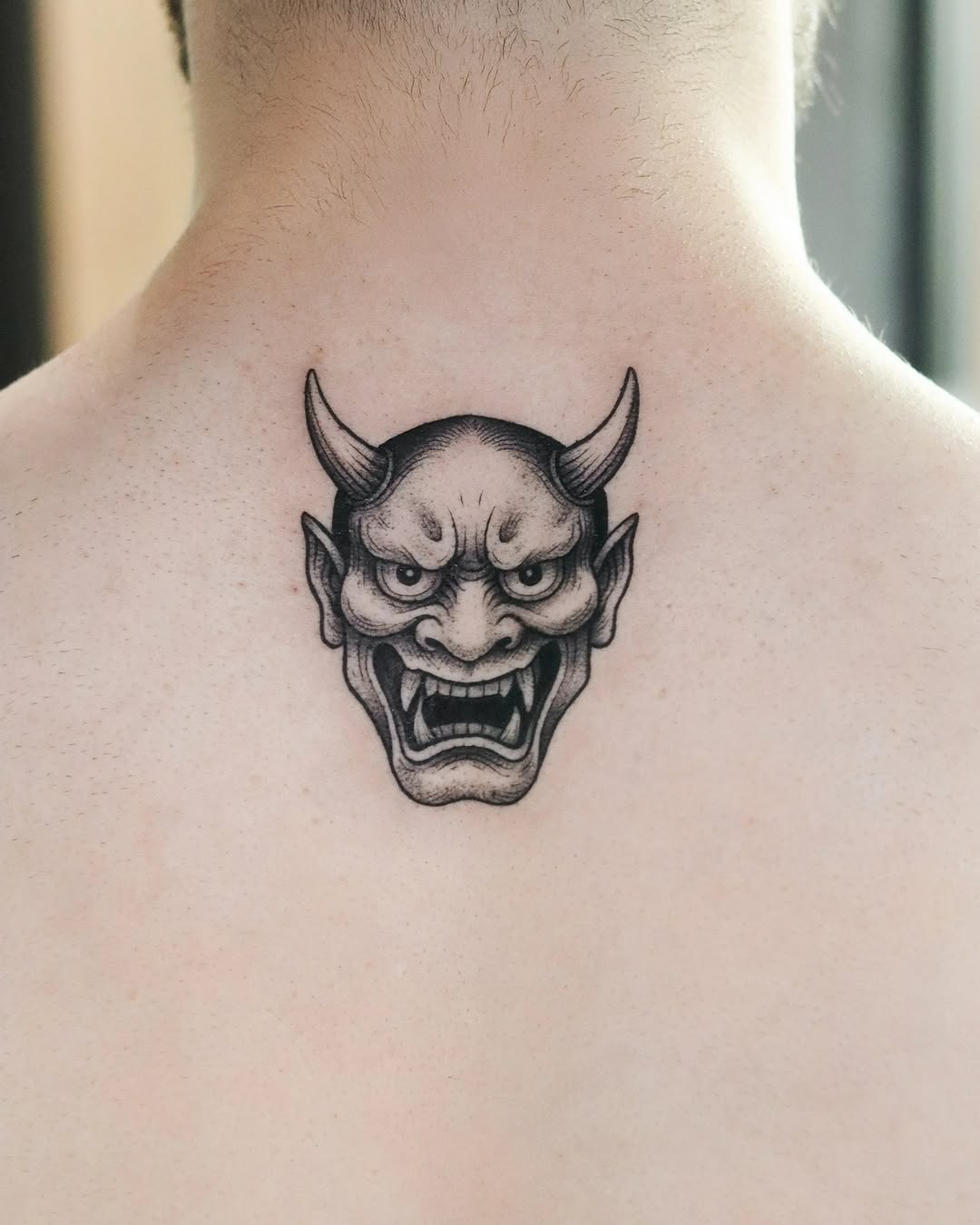 Monochrome Hannya mask with bold linework