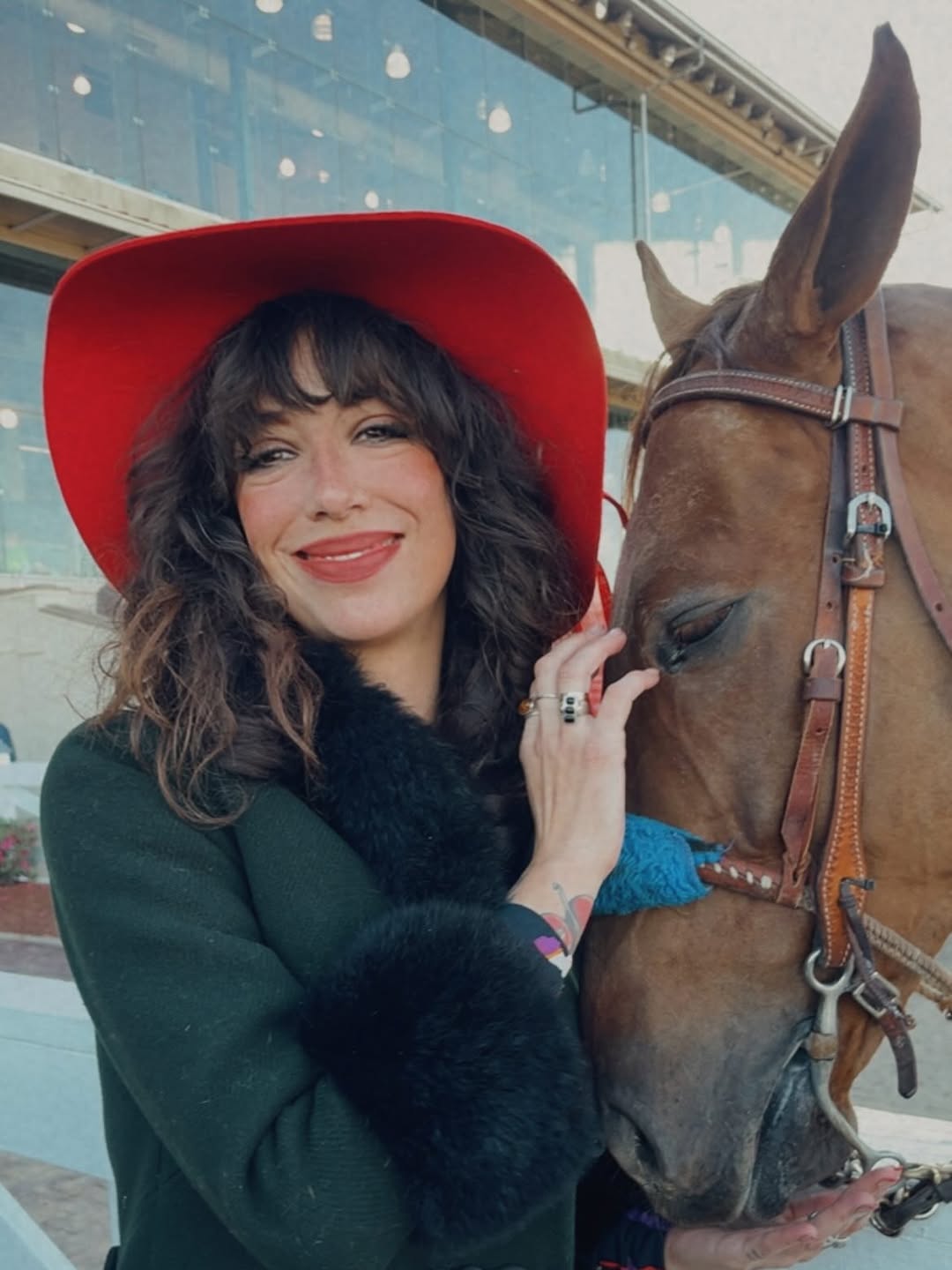 Delicate abstract colorful forearm tattoo with soft hues.