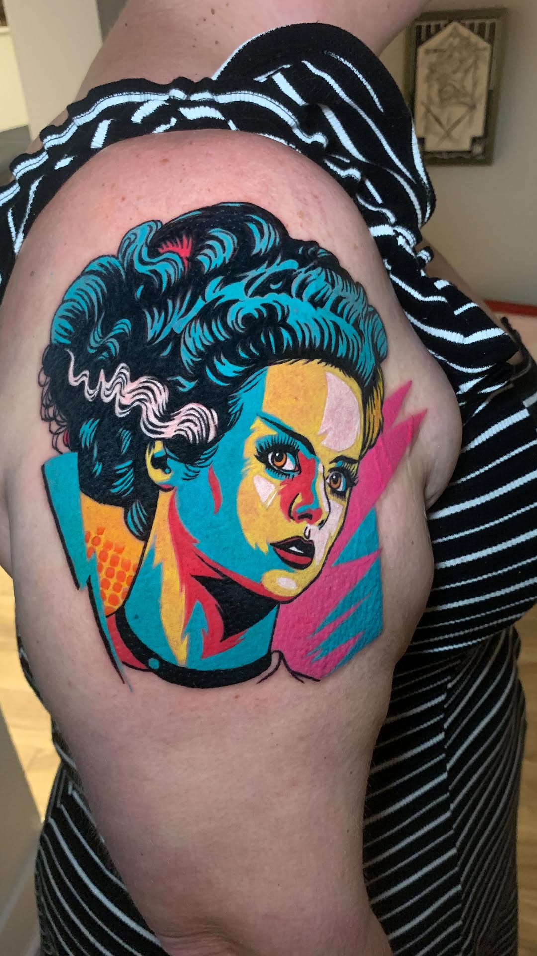 Vivid pop-art Bride of Frankenstein portrait on upper arm