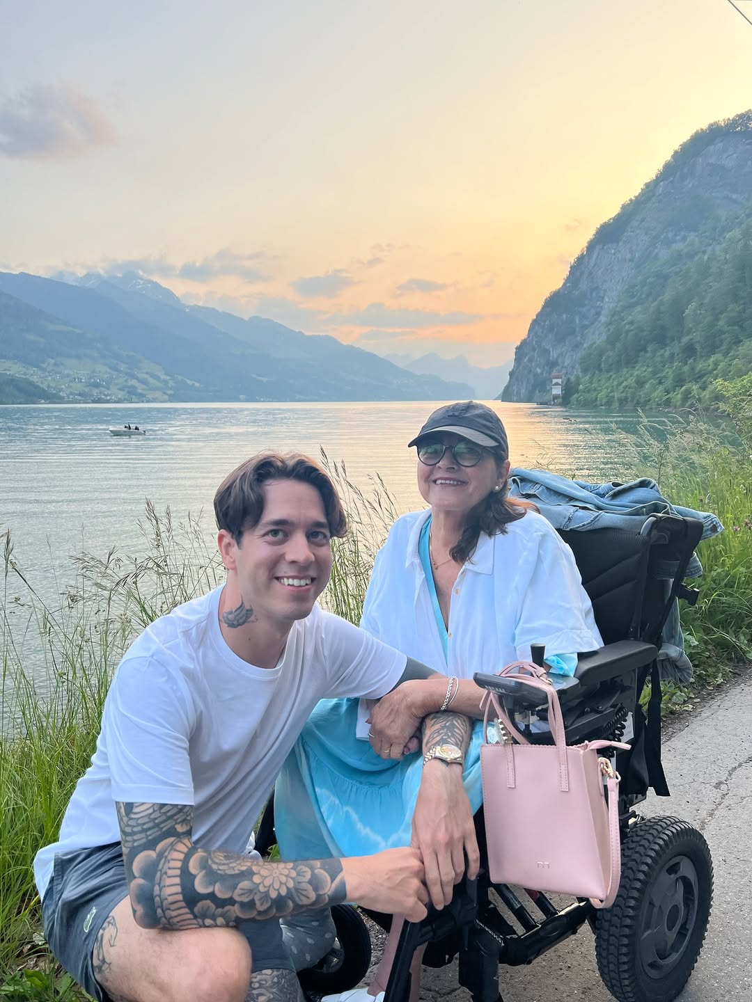 Bold black floral forearm sleeve with intricate shading.