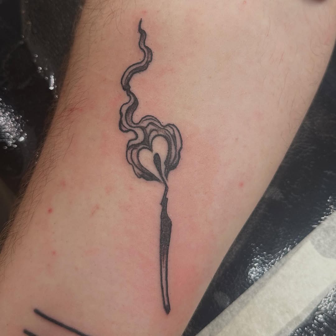 Delicate matchstick with heart-shaped flame, bold linework