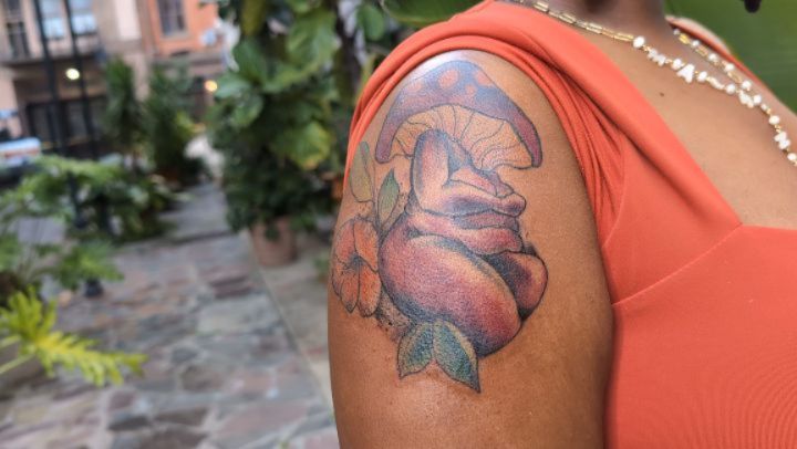 Vibrant neo-traditional mushroom bouquet with hibiscus.