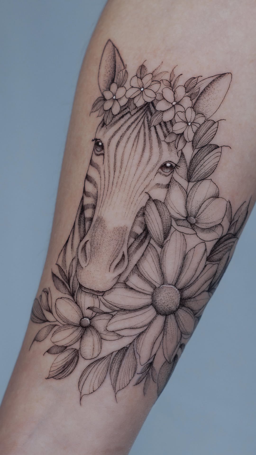 Delicate fine-line zebra portrait with floral crown