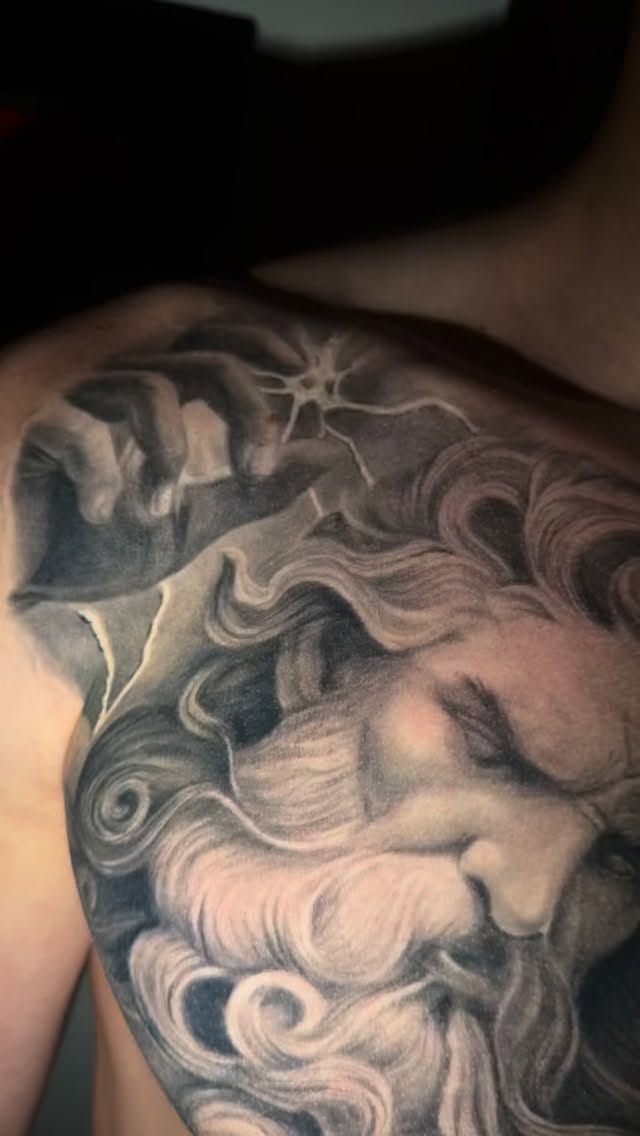 Monumental grayscale portrait with flowing hair and serene gaze