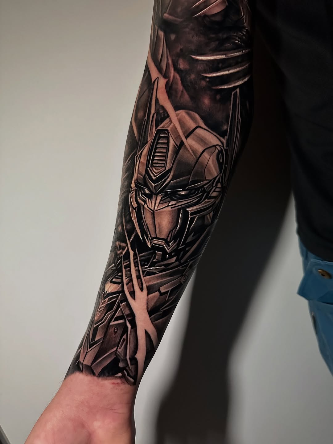 Intricate black-and-grey Transformer helmet with robotic lines