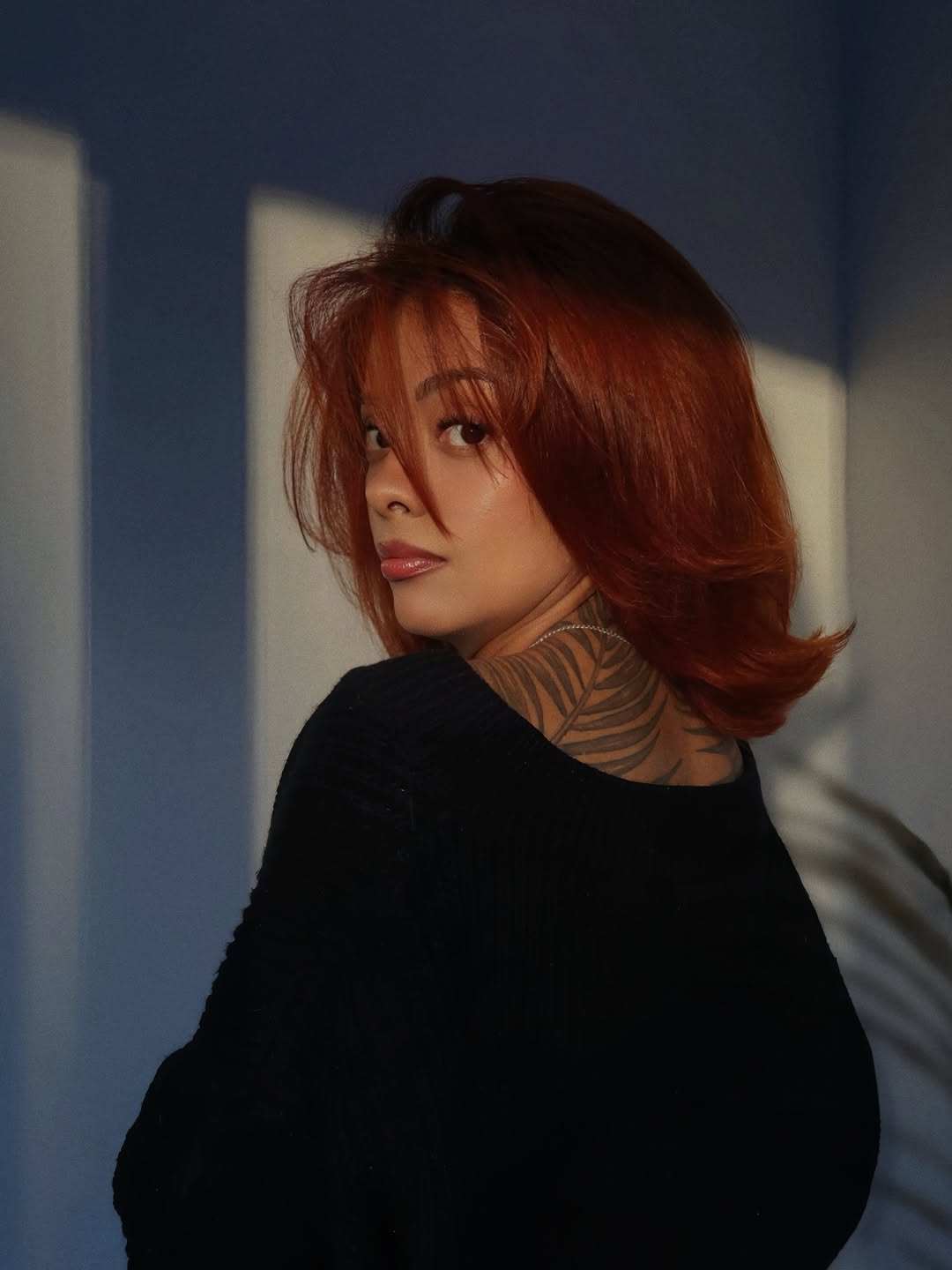 Bold blackwork neck botanical with flowing leaf pattern