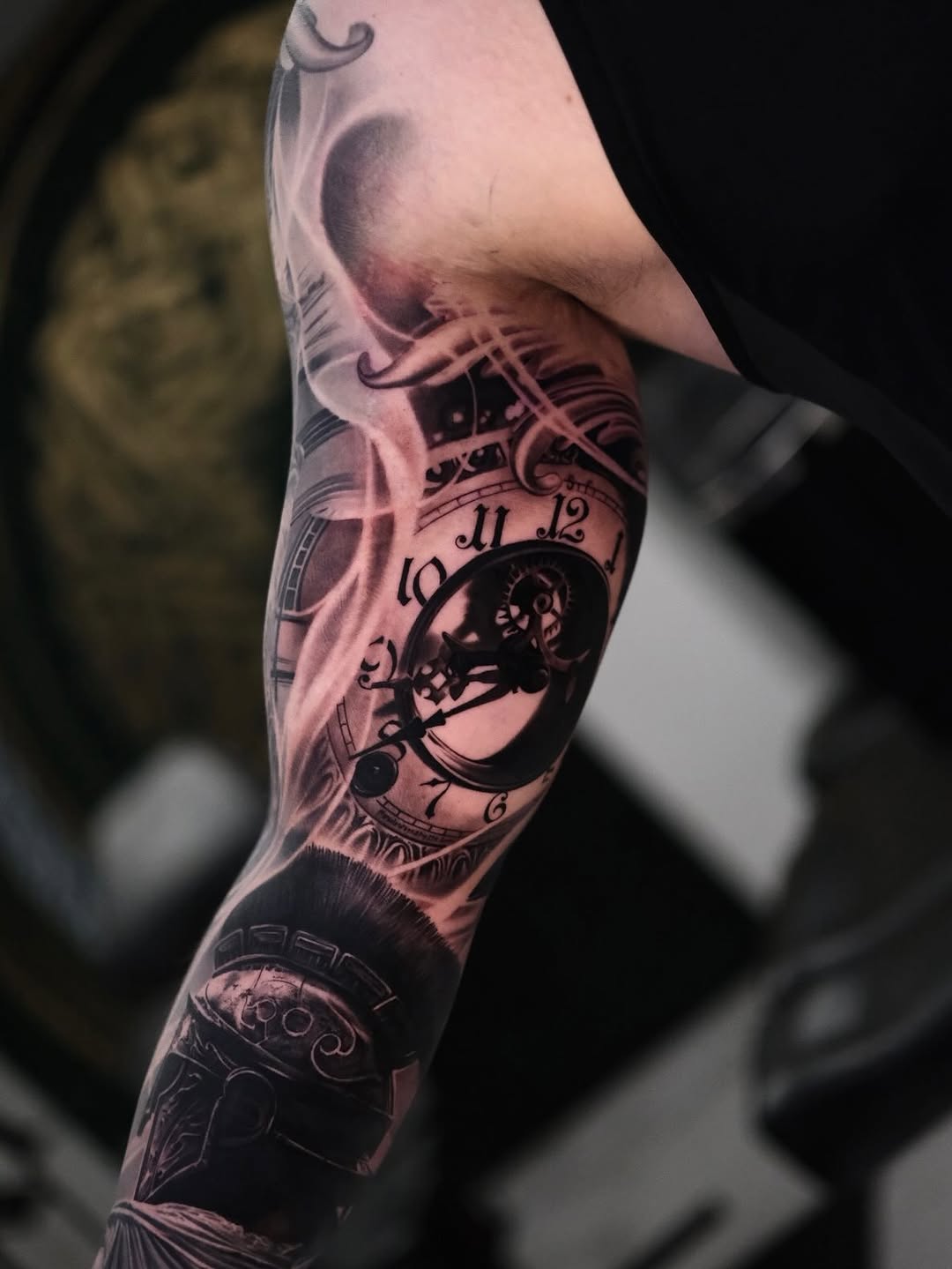 Intricate black-and-gray steampunk sleeve with gears and clocks.