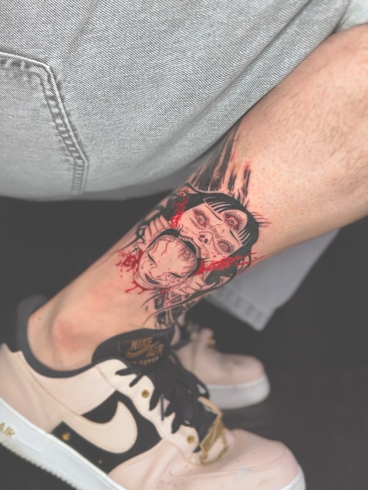 Two screaming faces in bold linework with red splatter