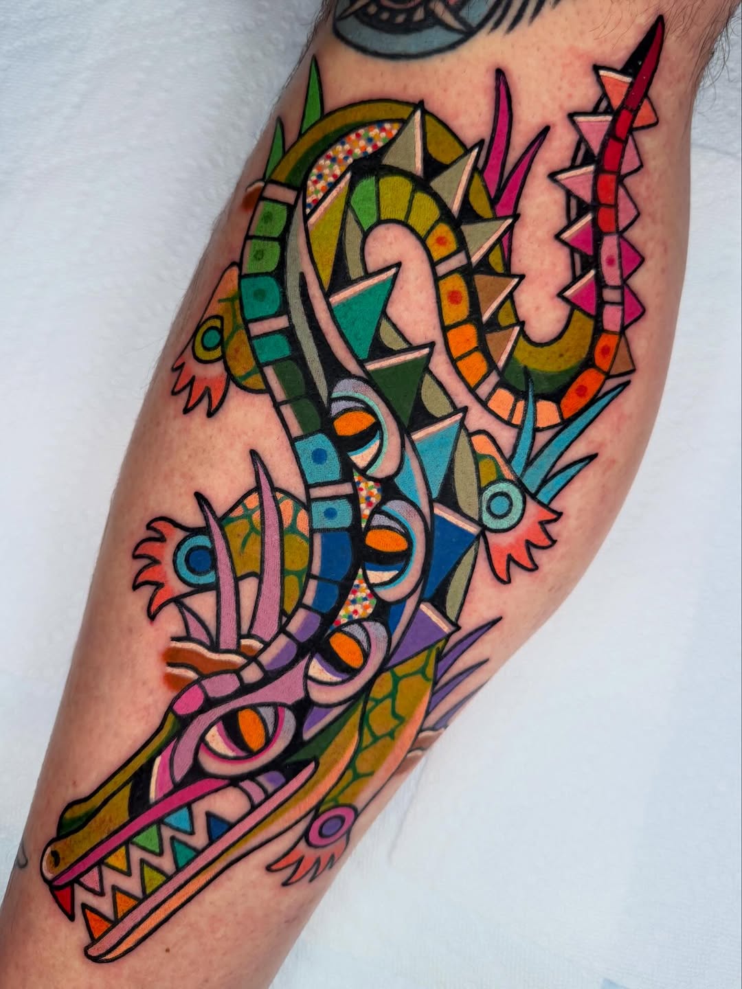Vibrant geometric dragon with kaleidoscopic color blocks