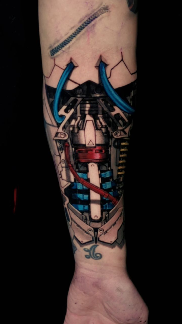 Vibrant biomechanical forearm piece with blue tubing