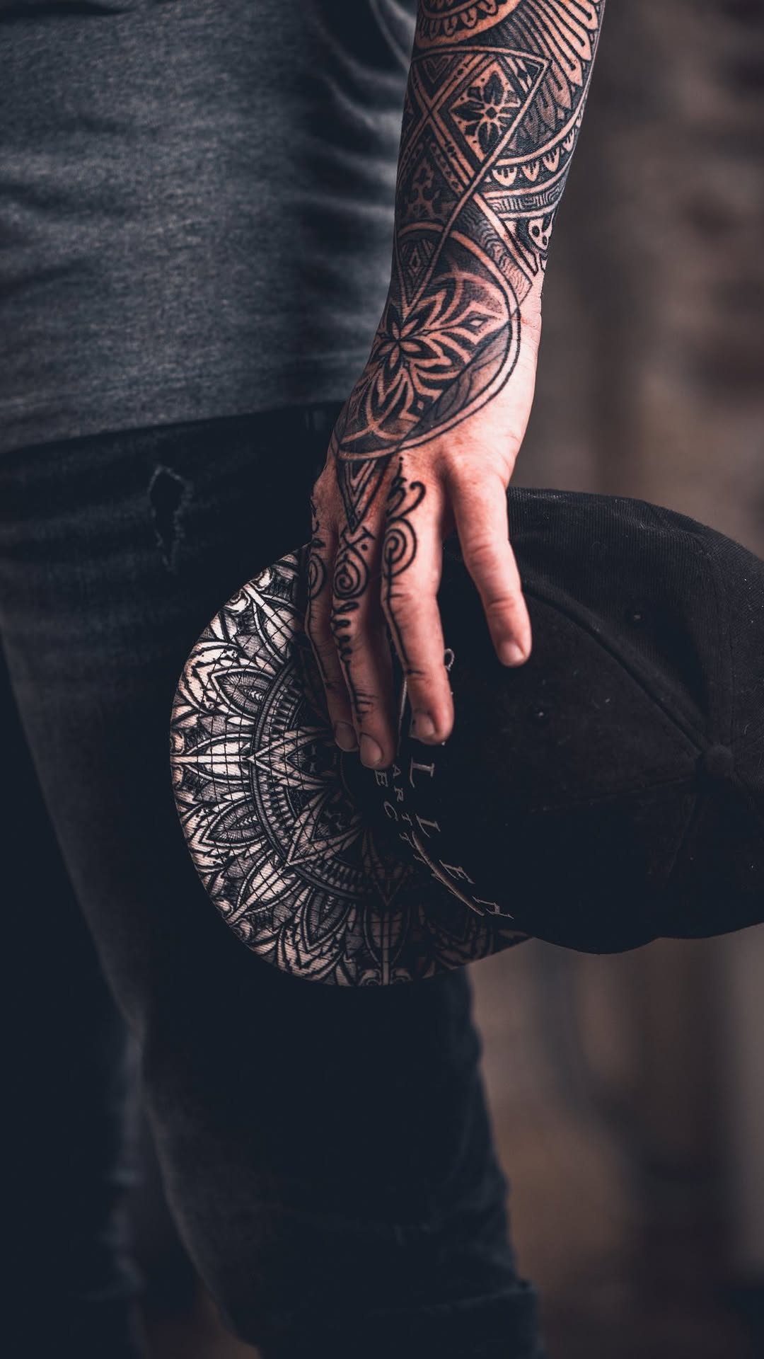 Intricate blackwork mandala sleeve with ornate finger accents