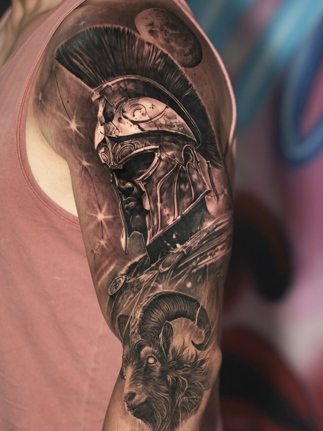 Hyper-detailed black-and-gray Spartan helmet with ram on arm