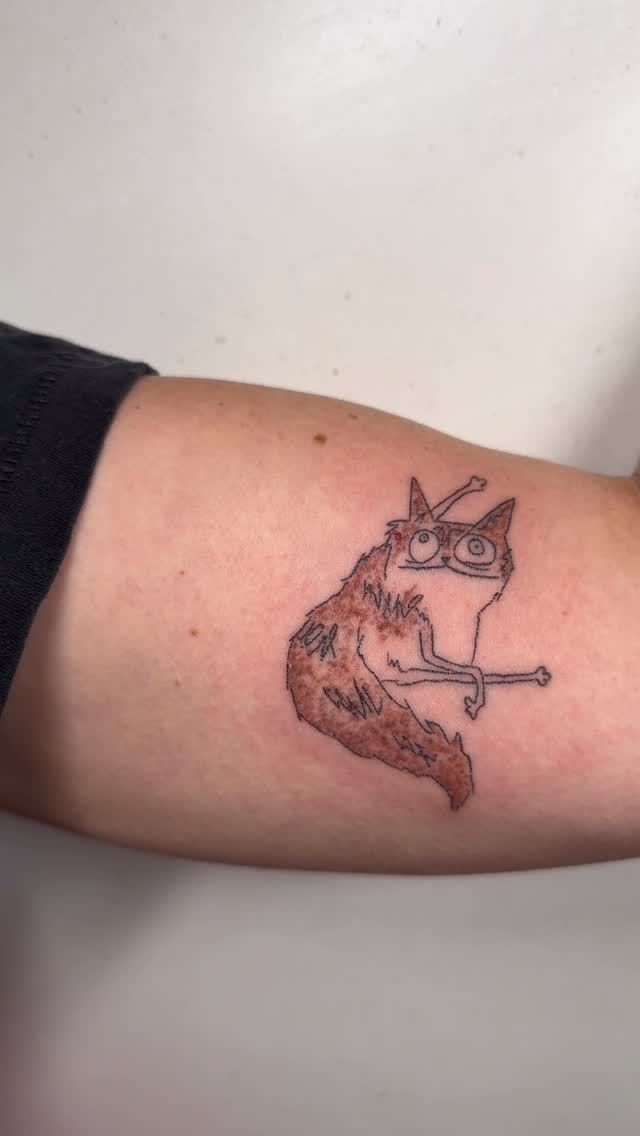 Derpy cat tattoo with glasses