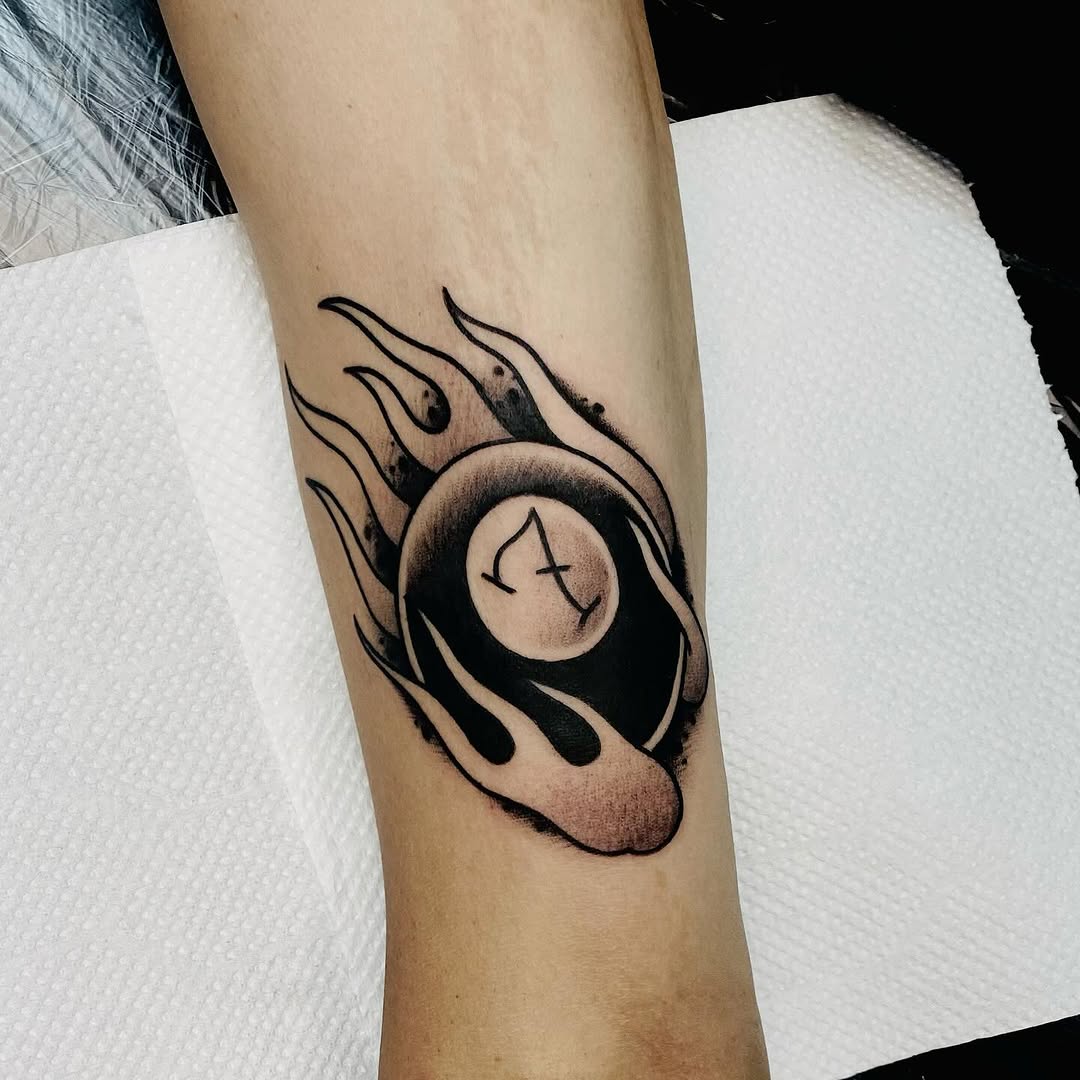 Flaming vortex surrounds a shaded orb with glyph.