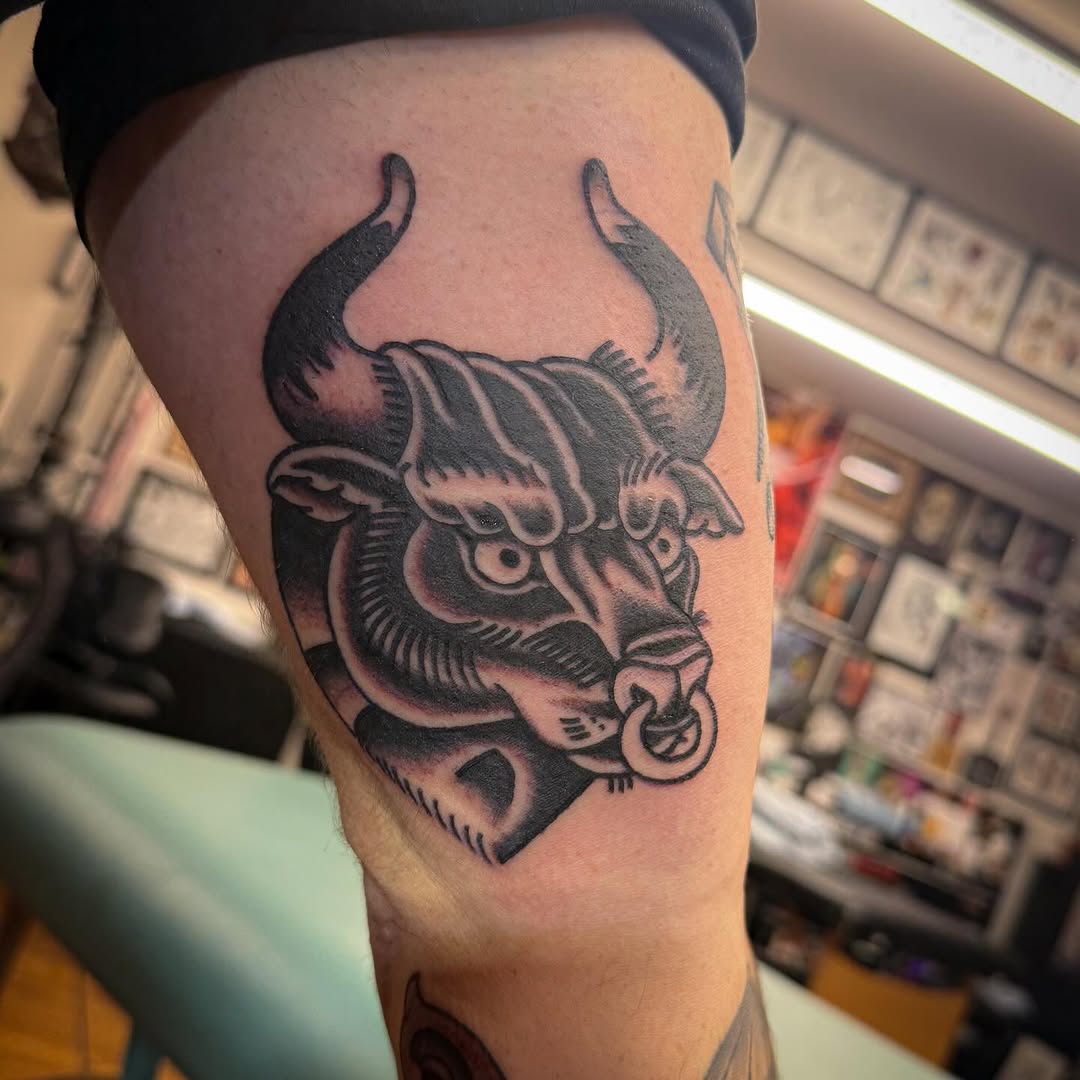 Bold blackwork bull head with ringed nose and horns.