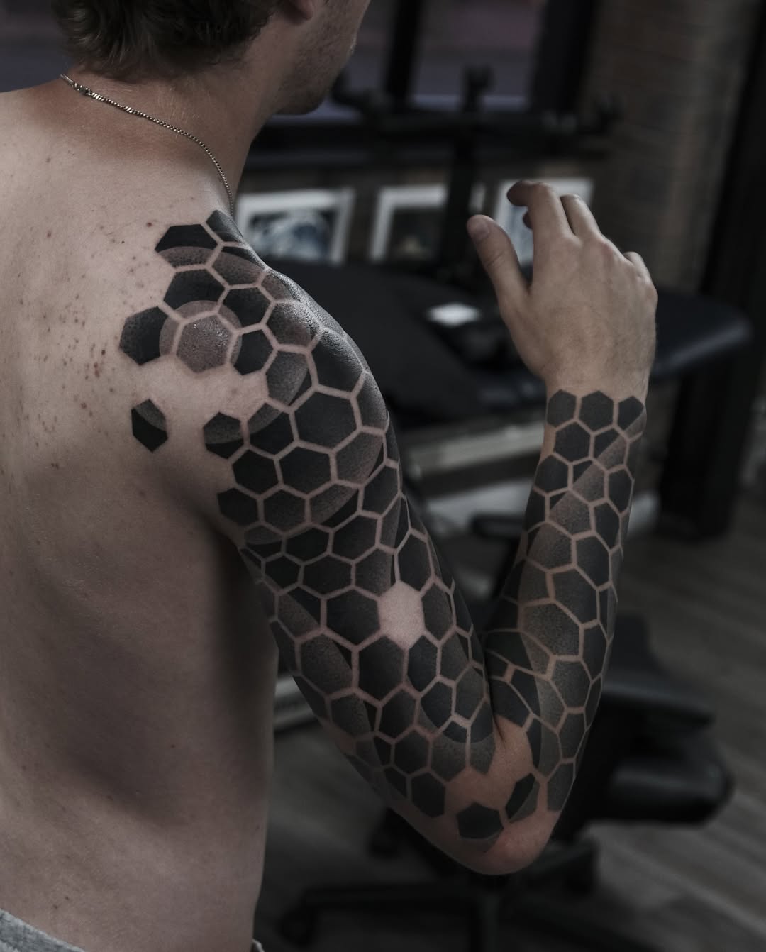 Geometric honeycomb sleeve in bold blackwork shading