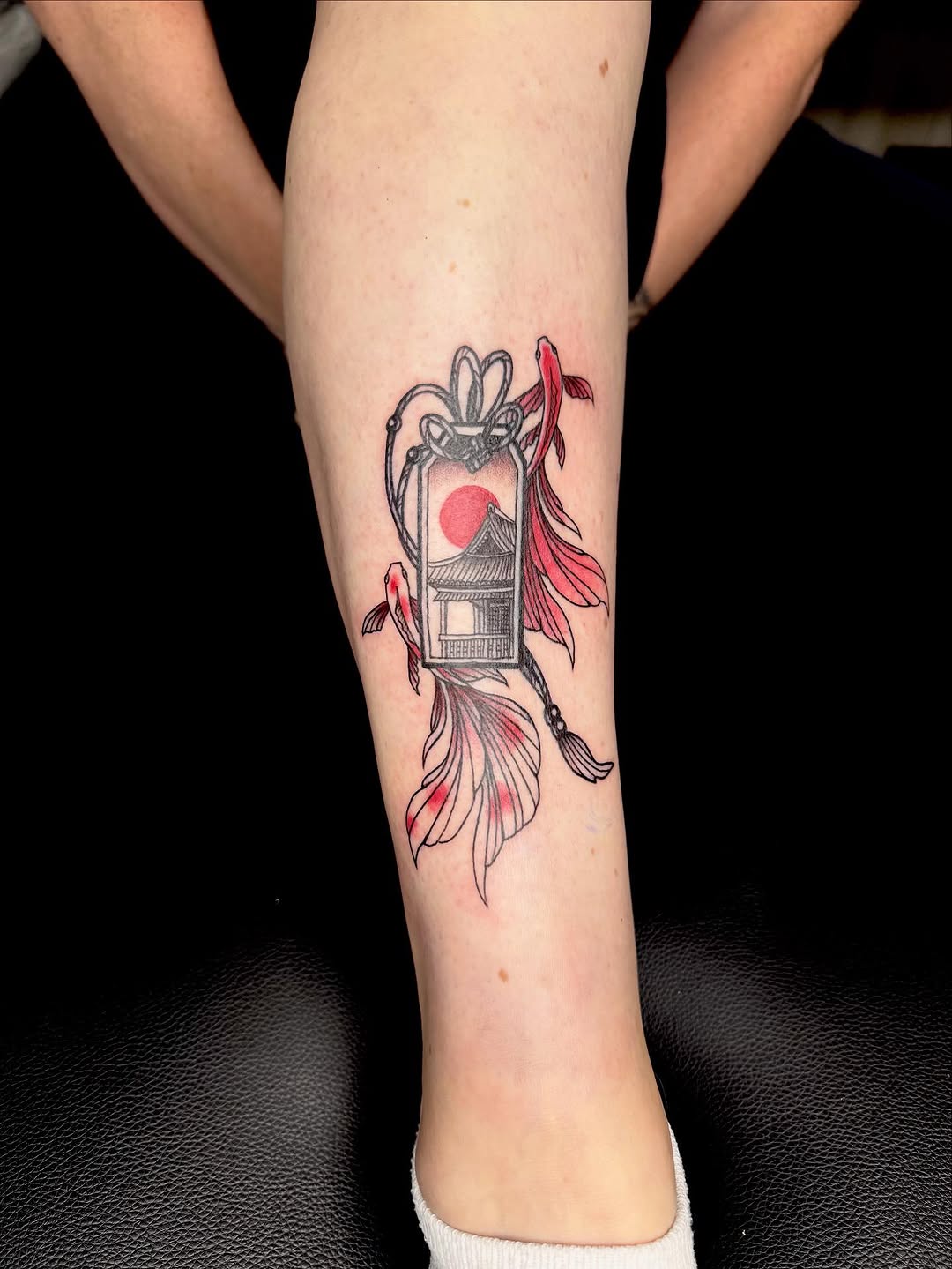 Japanese lantern motif with temple and red sun.