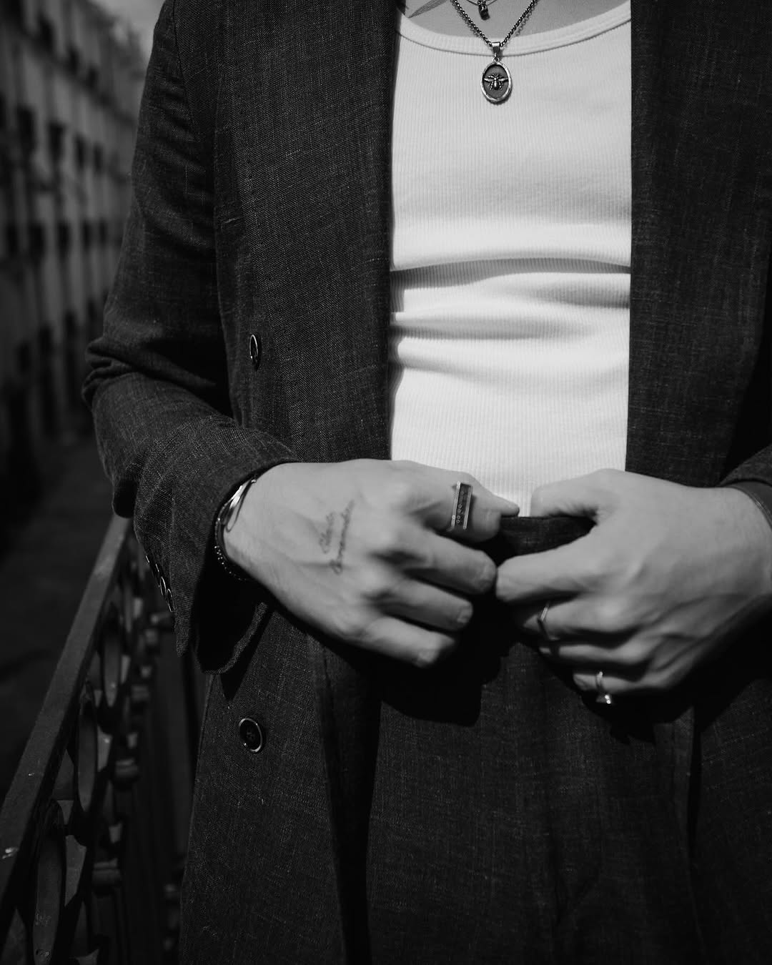 Delicate cursive wrist tattoo, subtly inked and elegant
