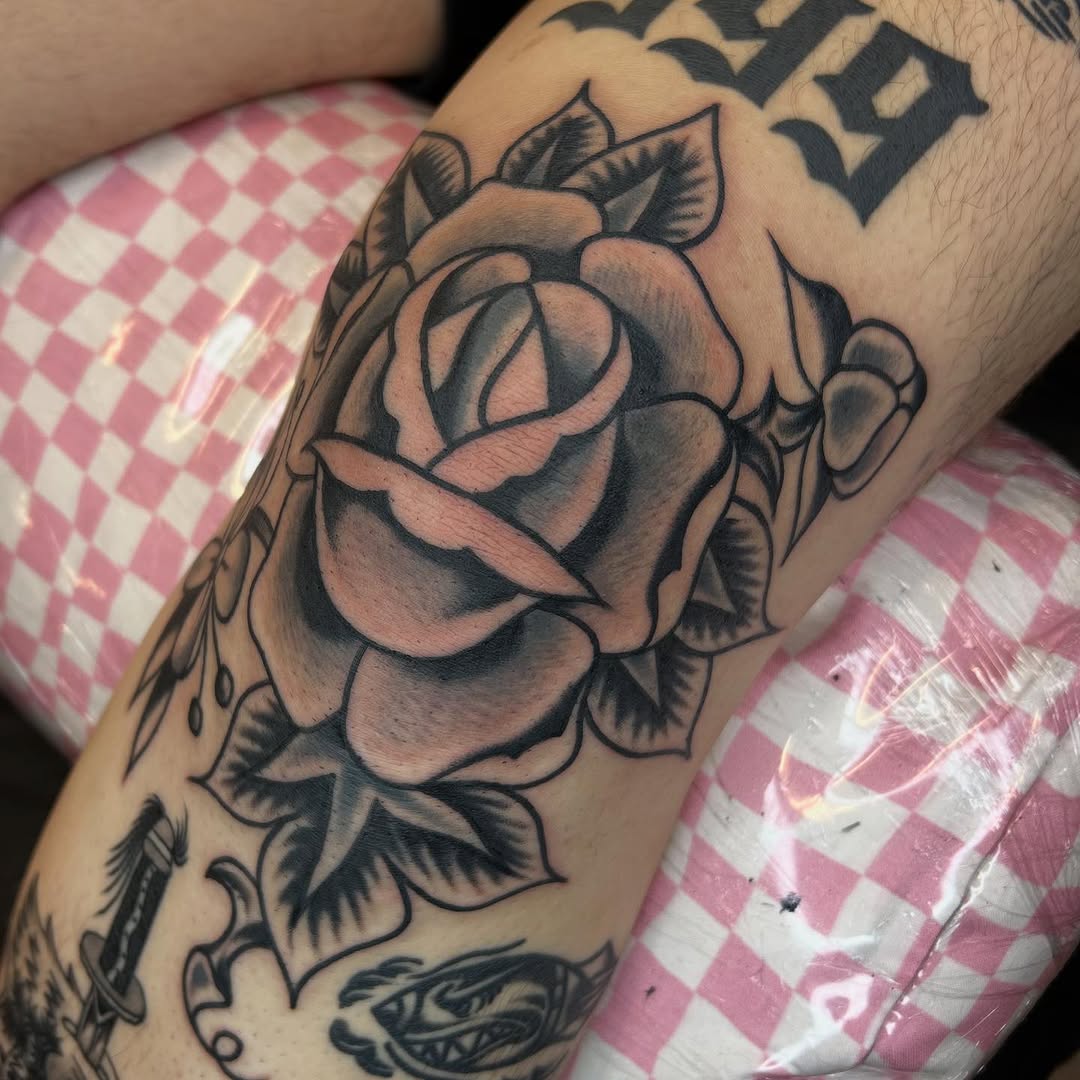 Bold black-and-gray rose with dramatic shading.