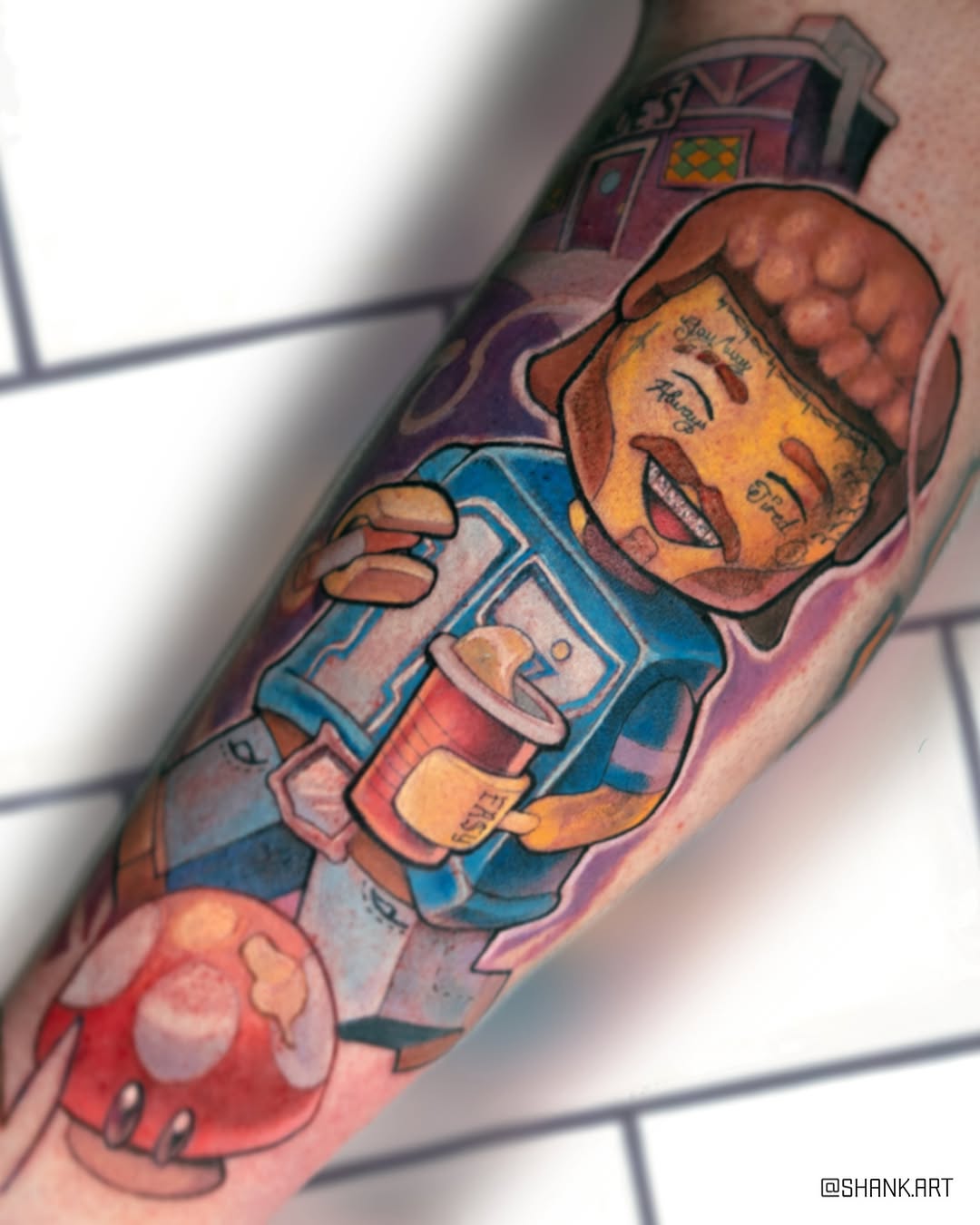 Vibrant cartoon space-scene leg tattoo featuring astronaut and alien