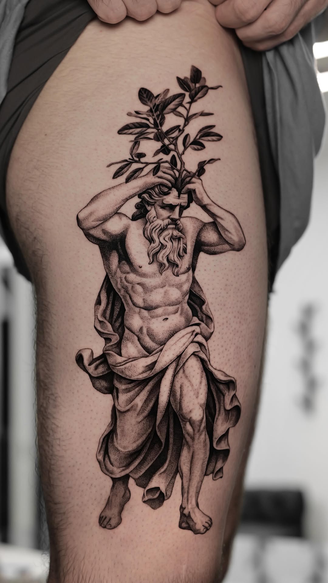 Zeus-inspired bearded god with leafy crown sprouting above head