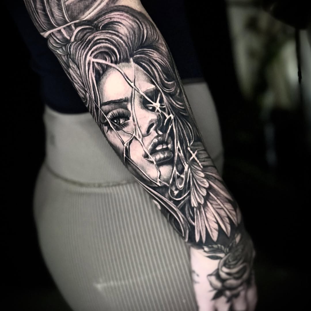 Cracked-glass portrait of a woman with feathered sleeve.