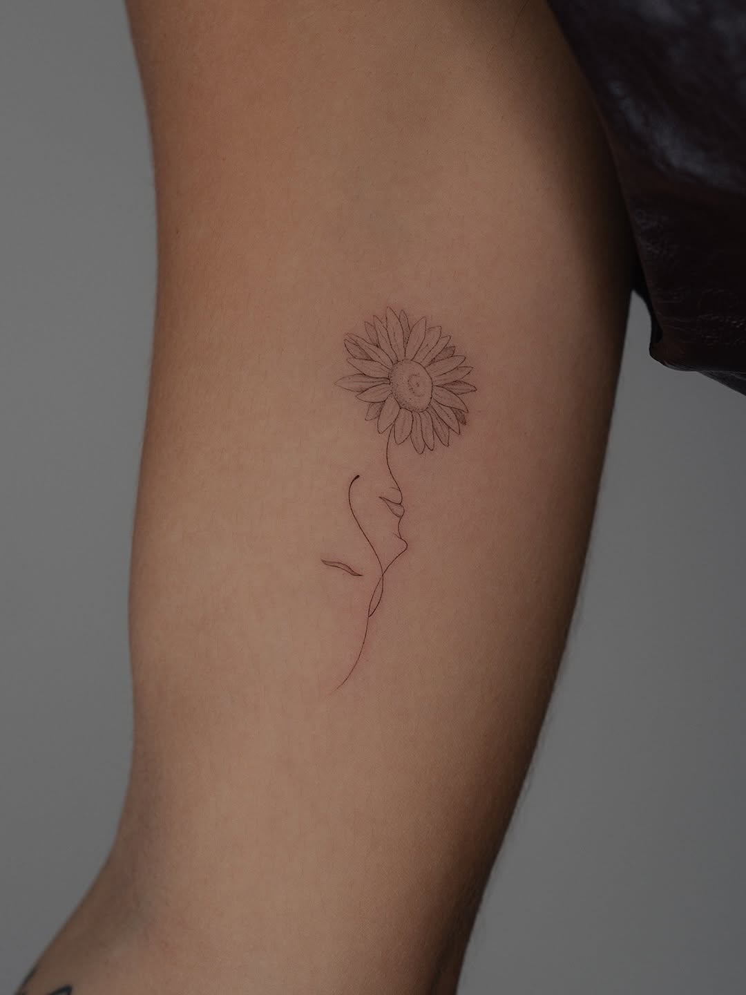 Delicate sunflower with a face integrated into the stem