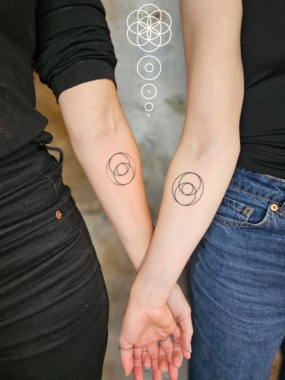 Minimalist concentric circle geometric forearm tattoos.