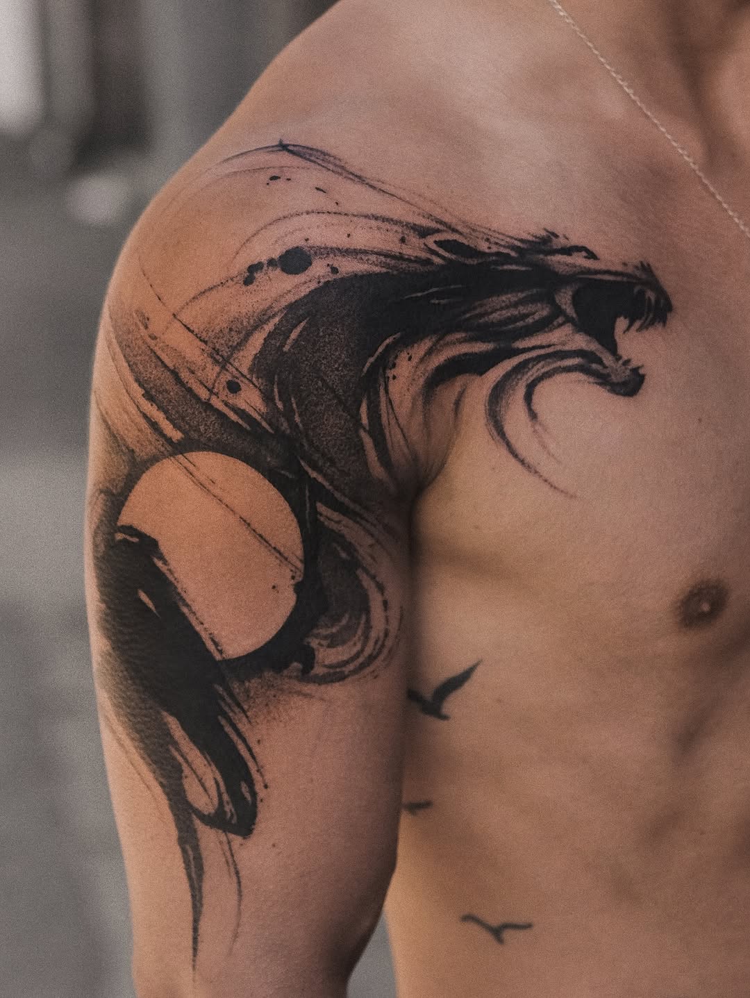 Bold brushstroke dragon wraps over shoulder with dynamic flow