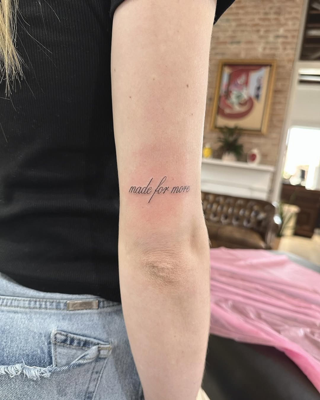 Delicate fineline cursive text reading 'made for more'.