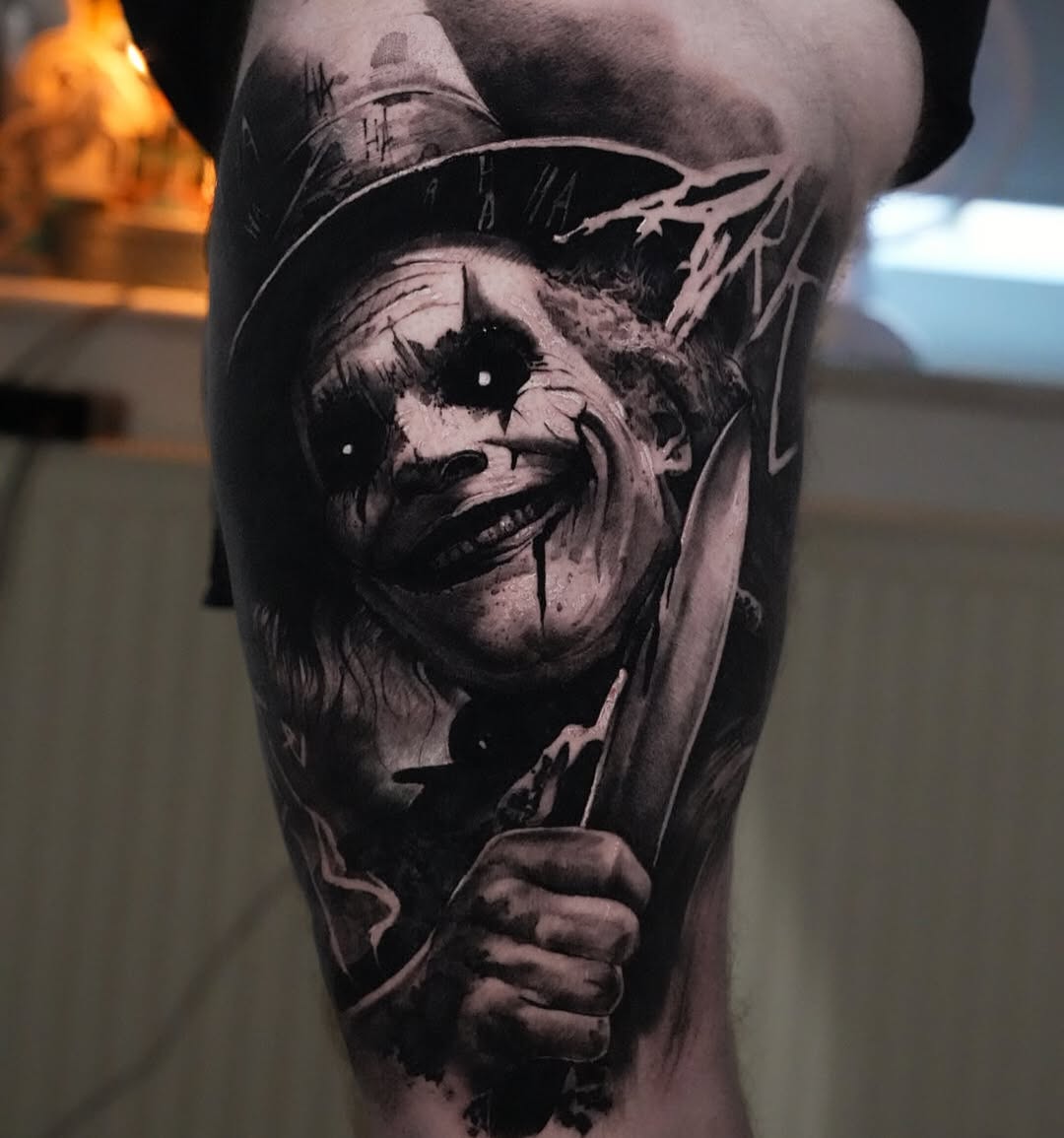 Hyper-detailed black-and-gray horror clown with knife on leg