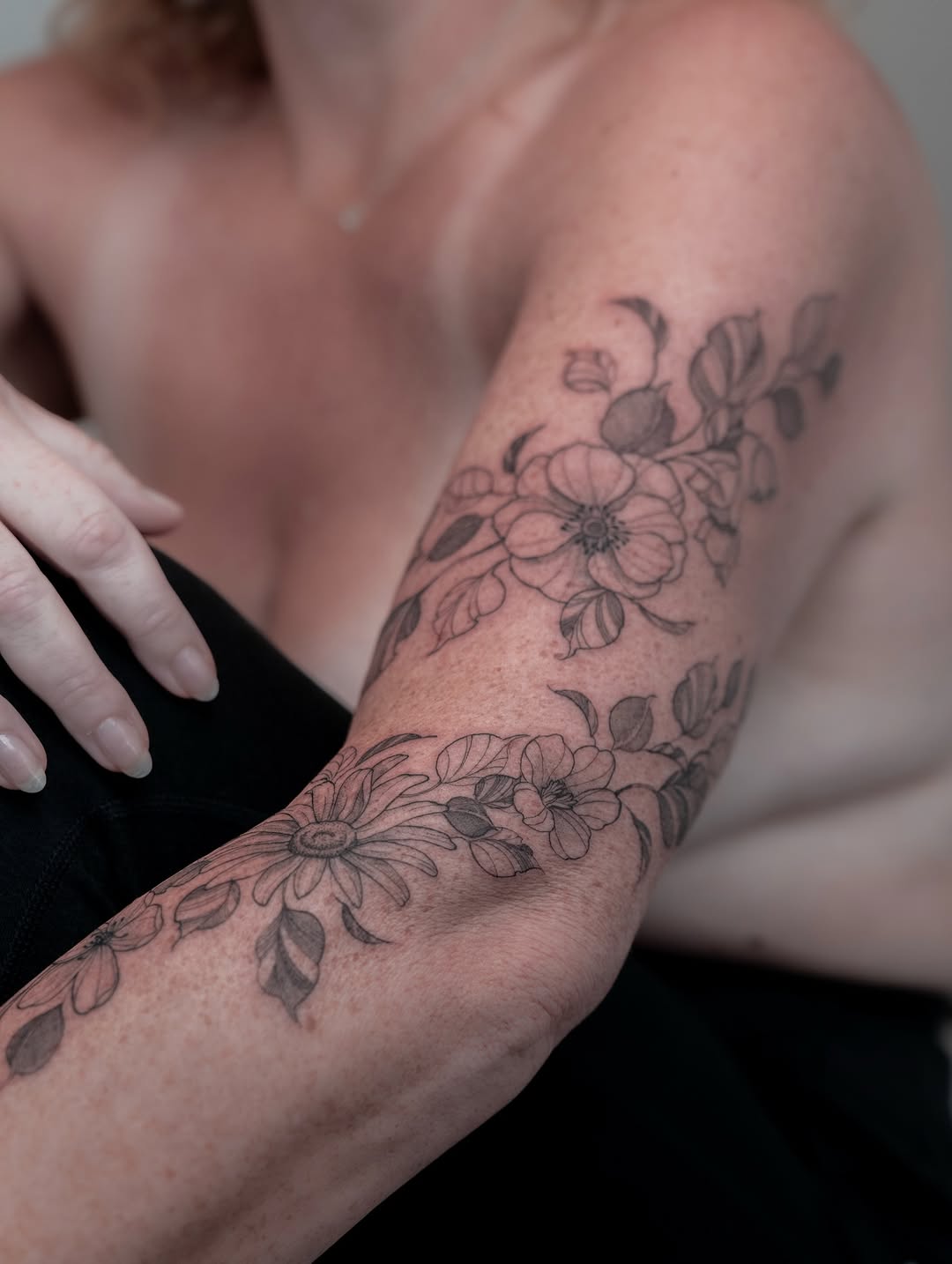 Delicate botanical floral sleeve in fine-line blackwork