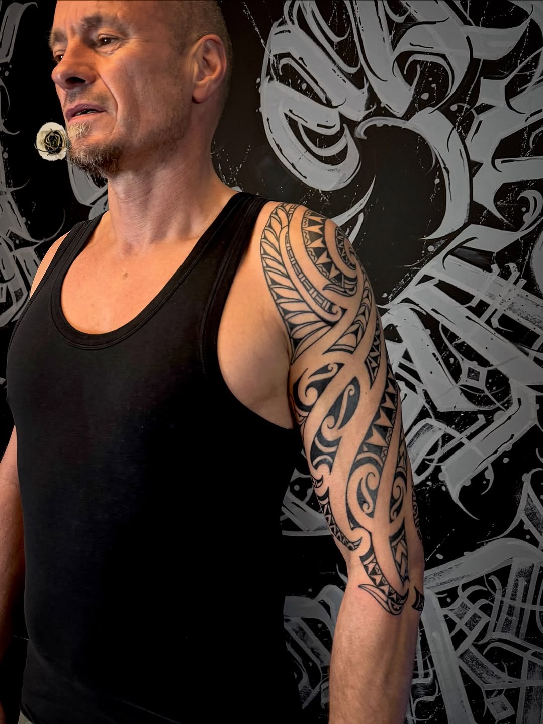 Bold tribal sleeve with sharp geometric blackwork patterns.