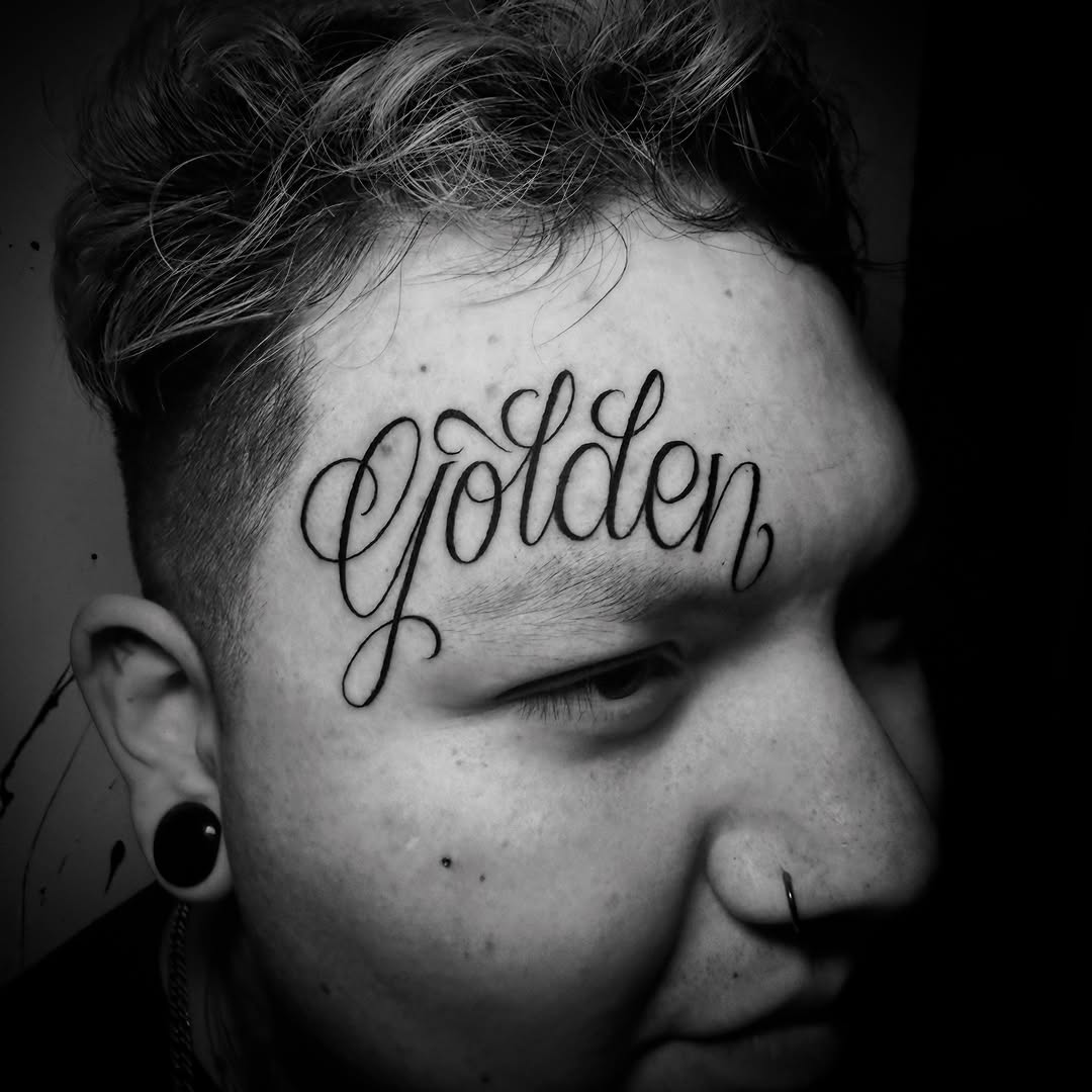 Elegant cursive 'Golden' script across the forehead