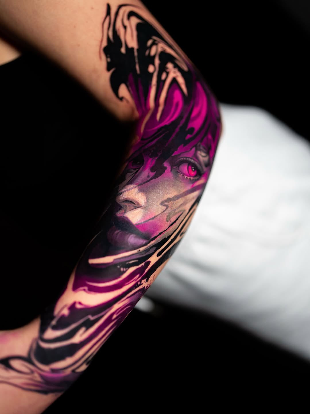 Vibrant magenta watercolor portrait wrapped in bold black accents