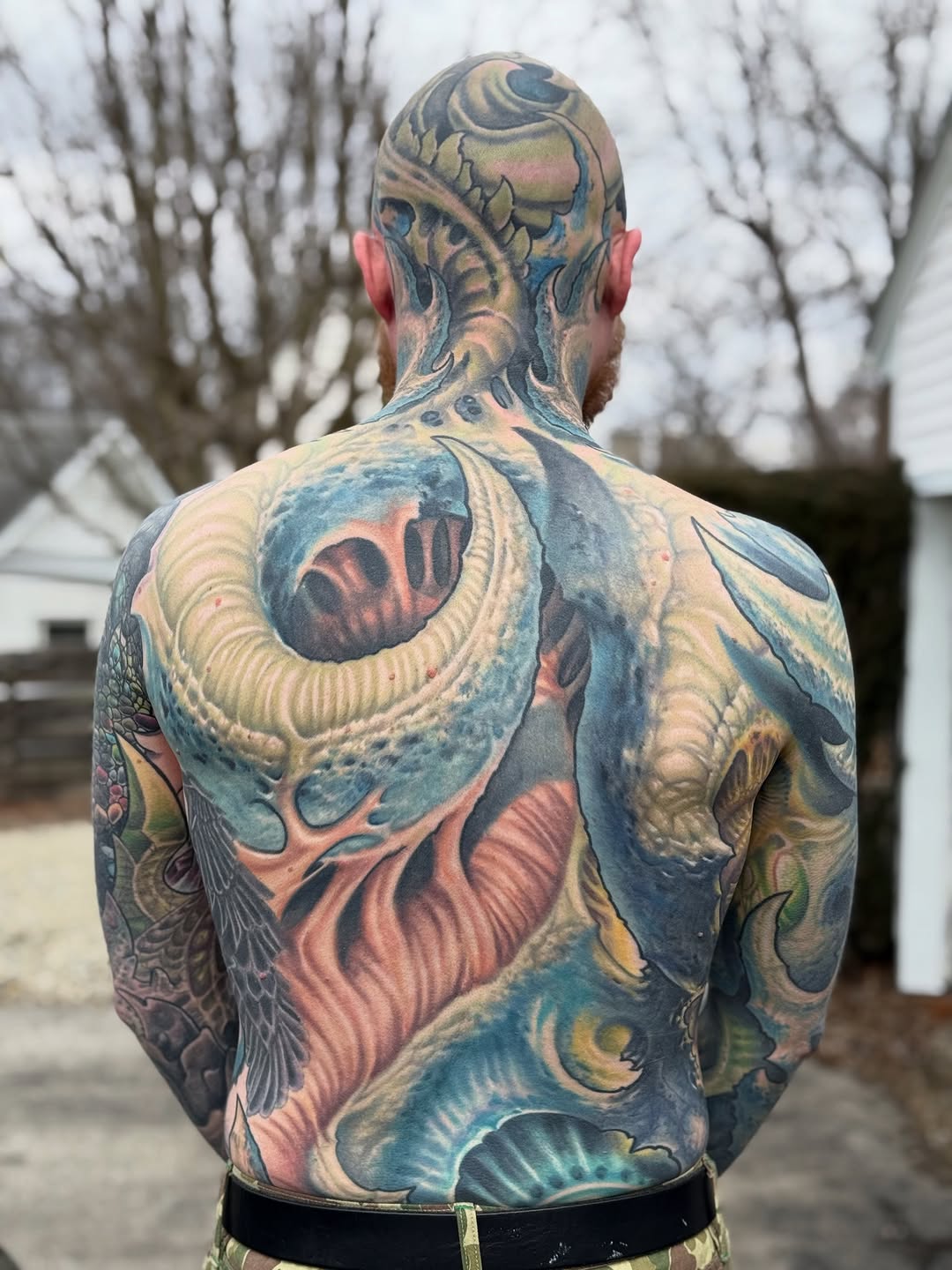Bold, fantastical full-back piece with oceanic forms.