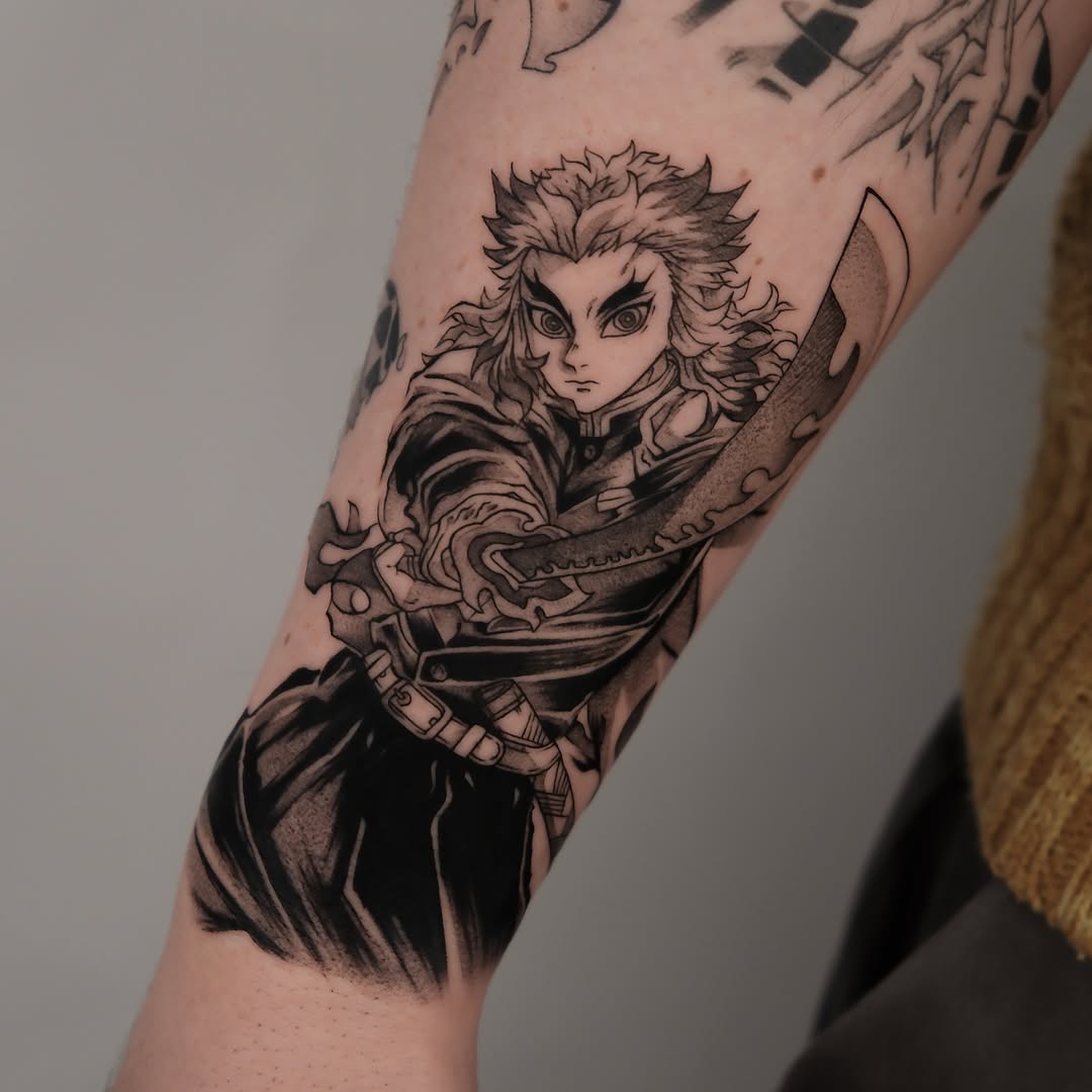 Bold blackwork Demon Slayer forearm piece of Kyojuro Rengoku