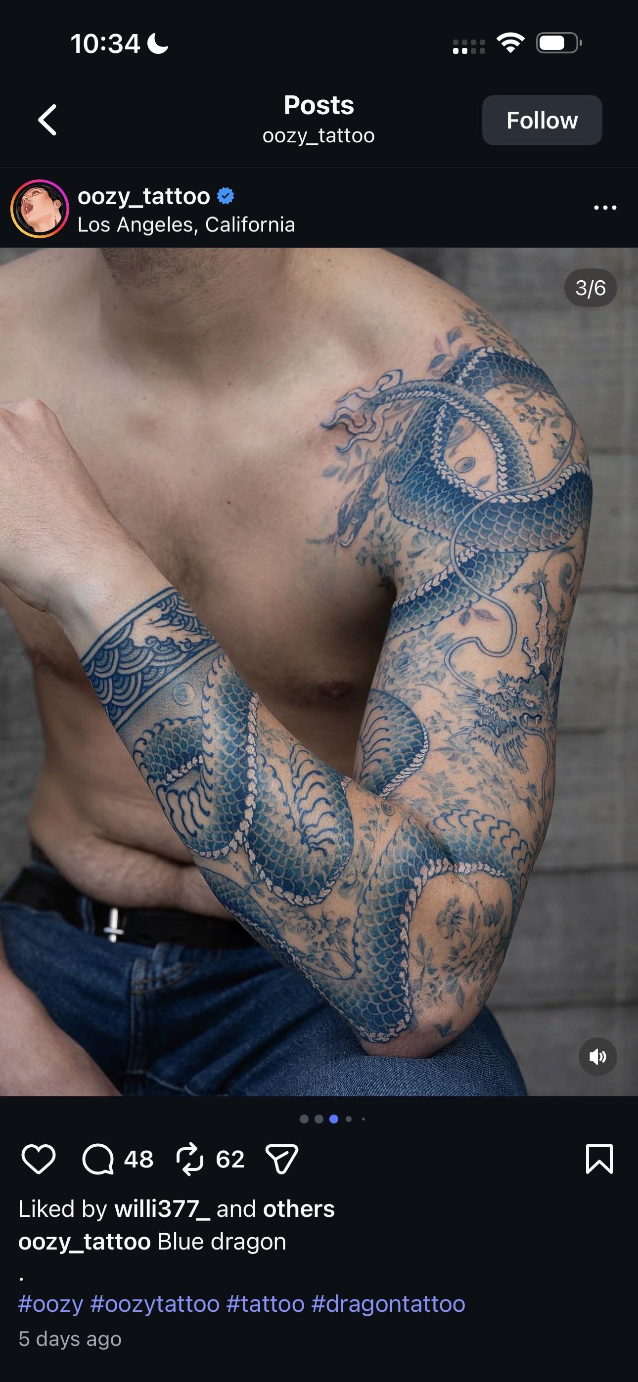 Coiled cobalt dragon sleeve with bold linework and shading