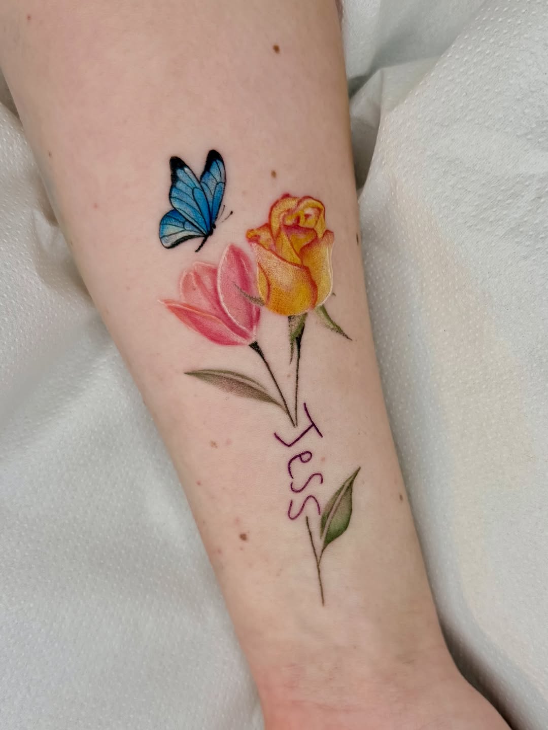 Delicate watercolor florals with pink tulip, yellow rose, handwritten name