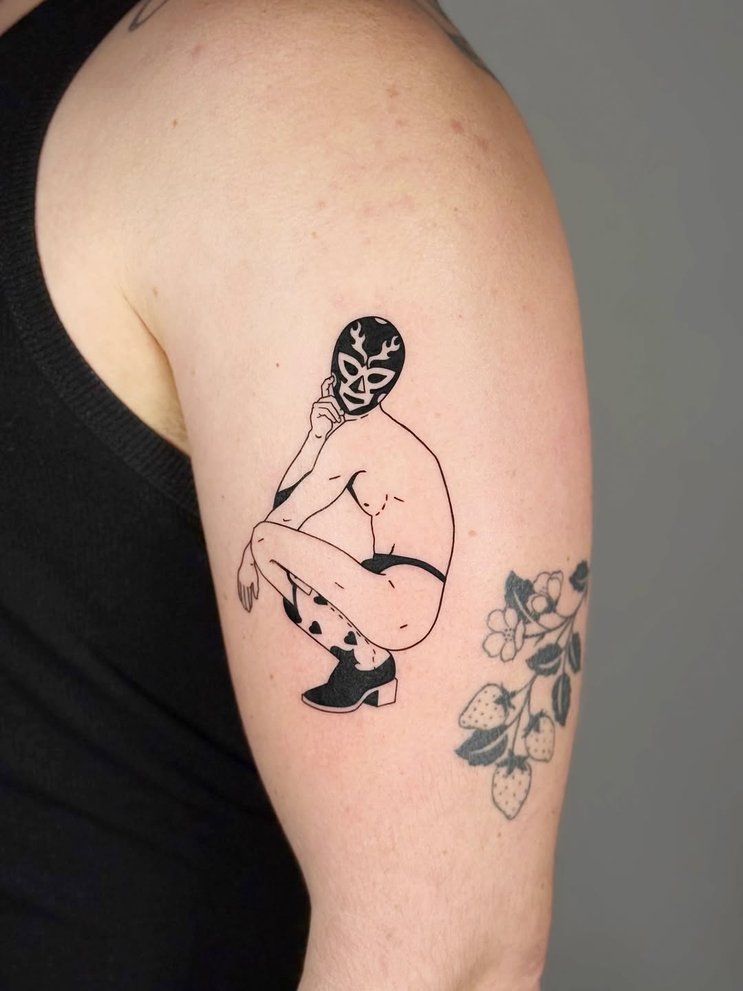 Bold line-worked luchador crouch in minimalist black ink