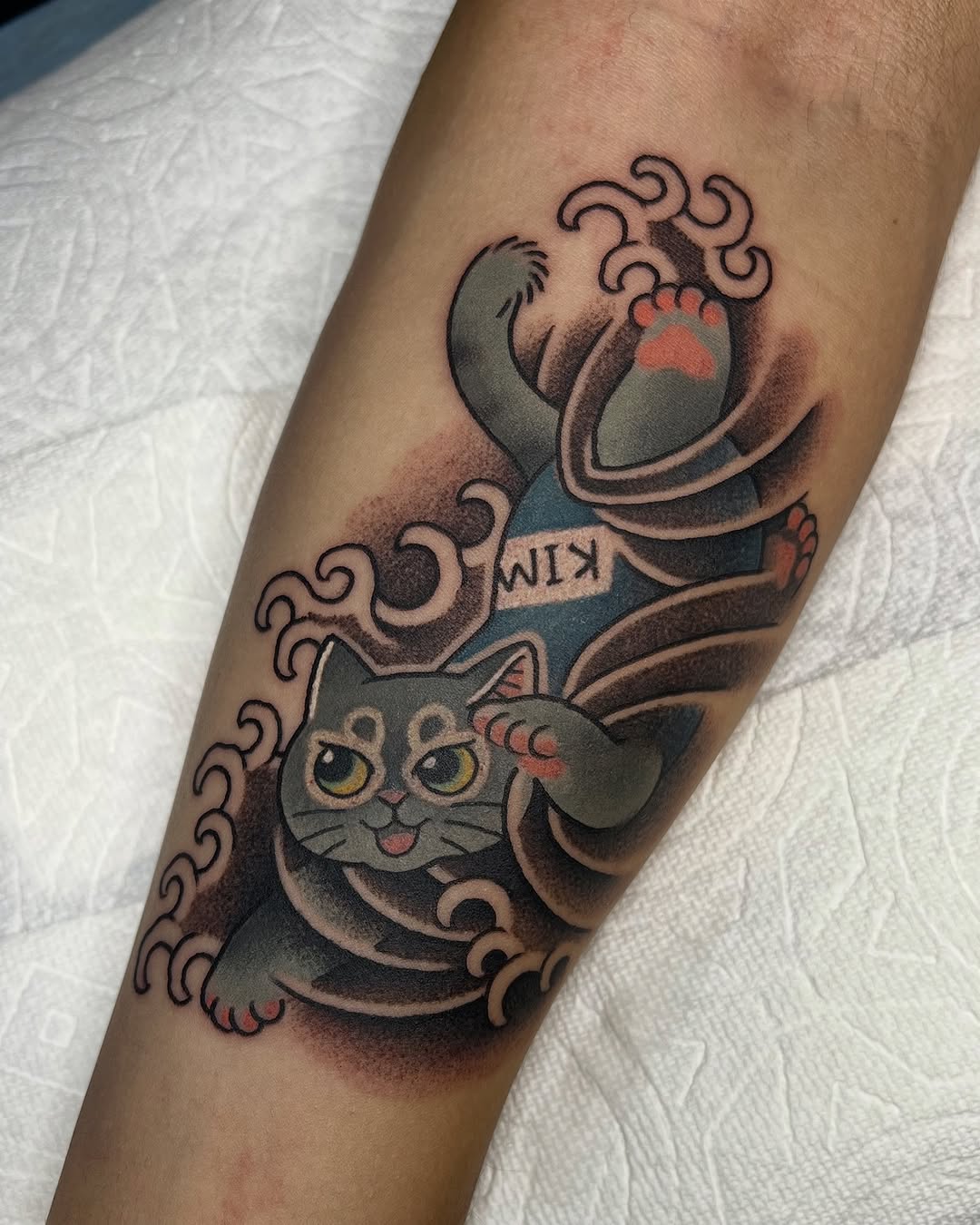 Bold maneki-neko cat with swirling waves, Japanese-inspired