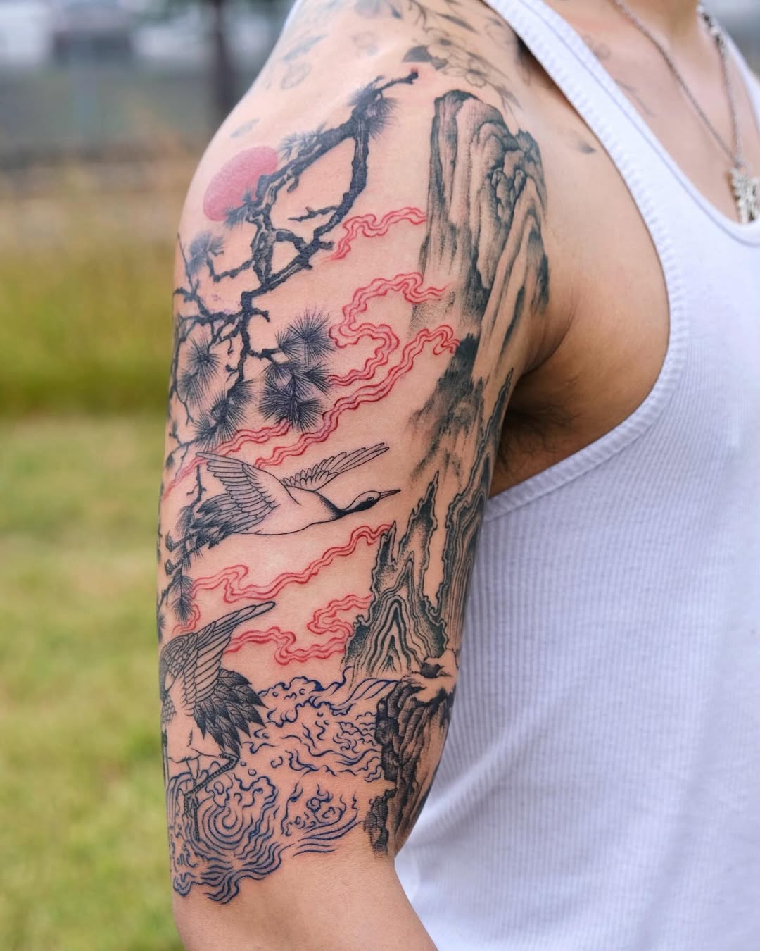 Japanese landscape sleeve with cranes, pines, and rolling waves