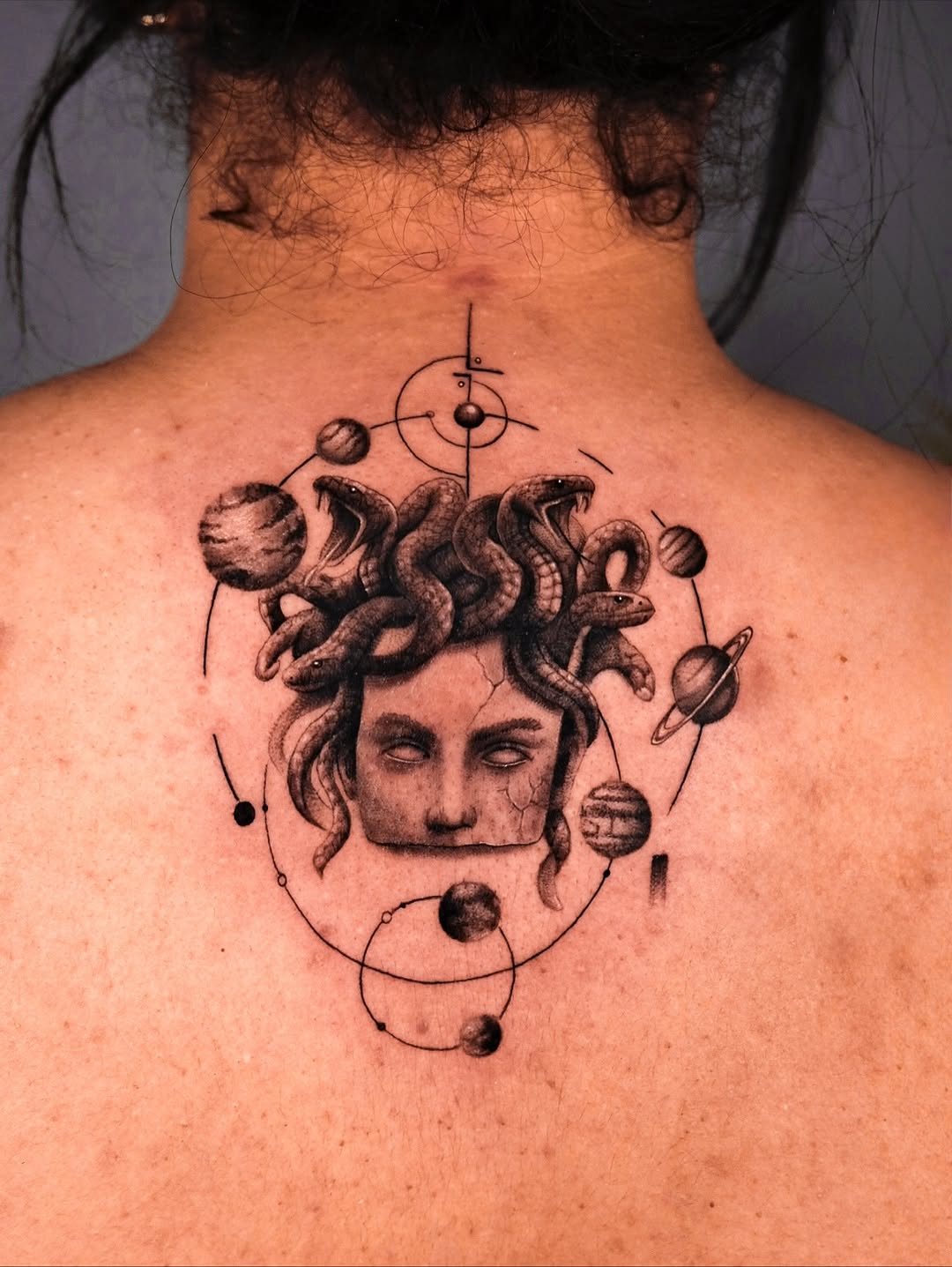Mythic Medusa portrait with serpents and cosmic geometry.