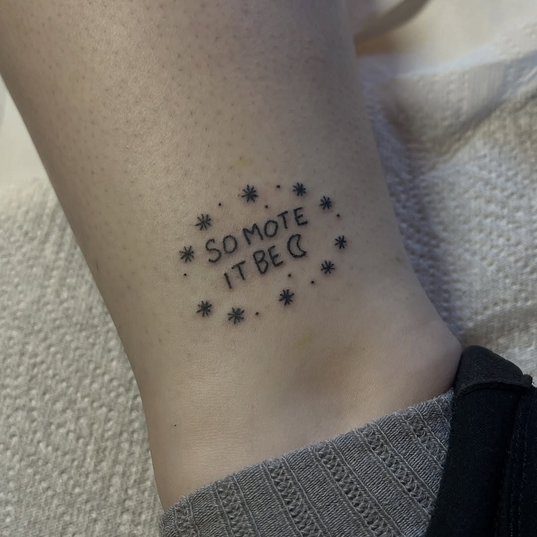 Hand-poked script with starry border around ankle tattoo.