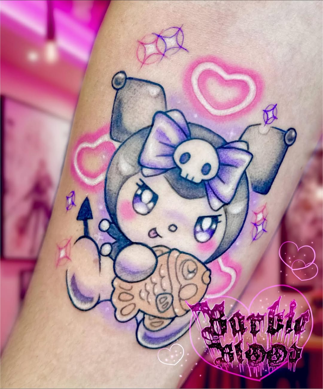 Harajuku-inspired Kuromi cartoon tattoo with pastel bow and taiyaki