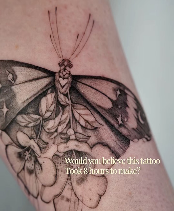 Elaborate fine-line butterfly with floral grayscale shading