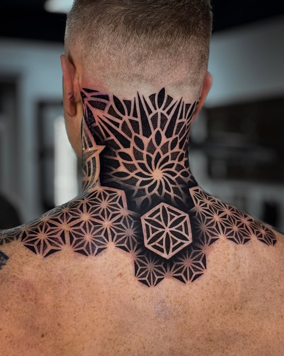 Intricate geometric mandala collar with dense dotwork