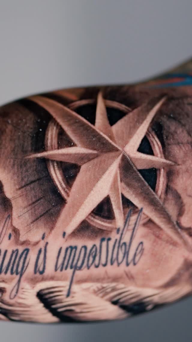 Dimensional black-and-gray compass rose with elegant script